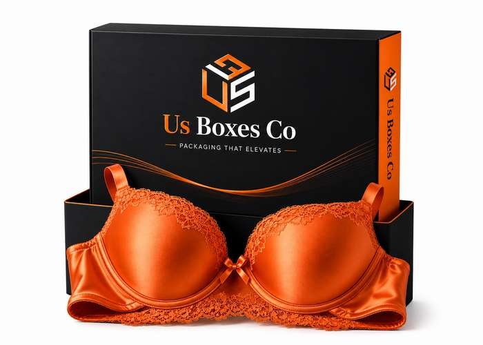 Orange bra in front of a black and orange packaging box.