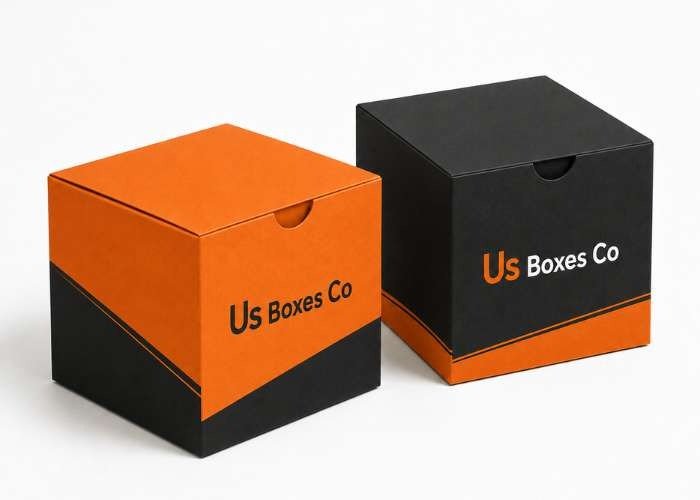 Orange and black cube boxes with US Boxes Co branding.