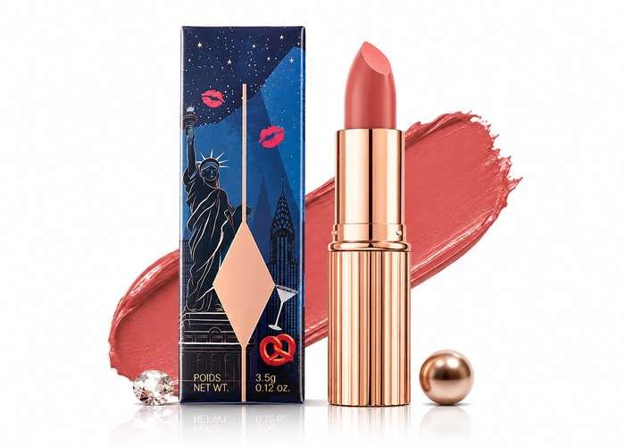 Elegant rose gold lipstick with a soft nude shade and matching color swatch, showcasing luxury cosmetic packaging.