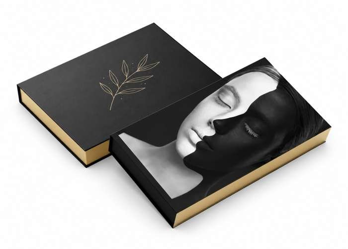 Luxury eyeshadow palette with bold black and gold artistic packaging.