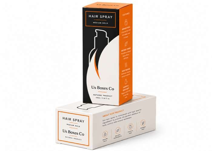 Hair spray packaging with bold black and orange design.