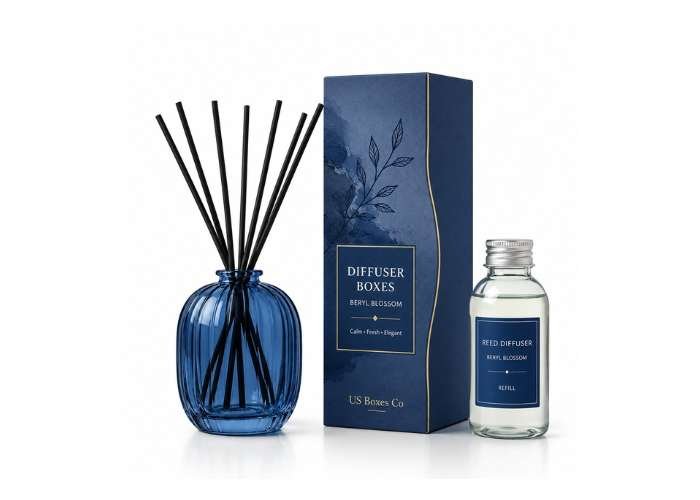 Blue reed diffuser bottle with matching packaging and refill bottle on a white background.