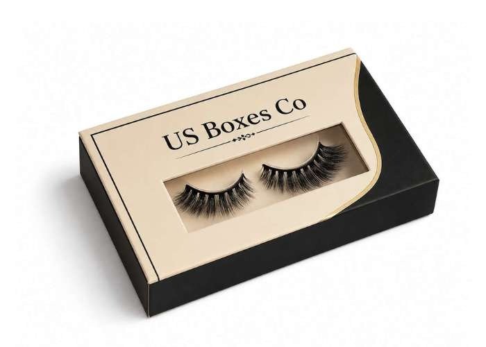 Luxury black and cream eyelash box with “US Boxes Co” branding and two dramatic false lashes.