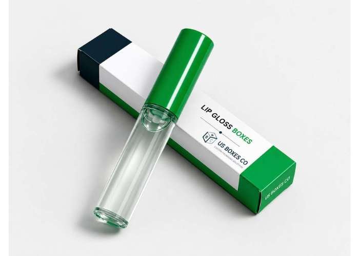 Green and white lip gloss box with a clear lip gloss tube on a white background.