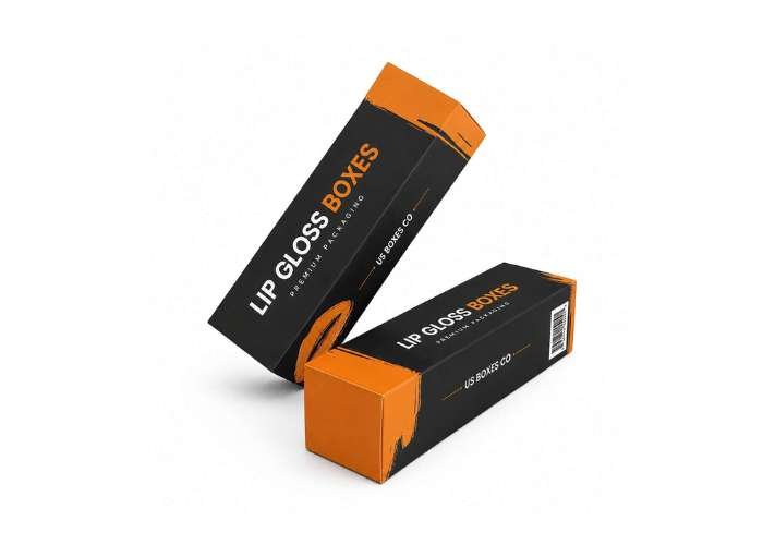 Black and orange lip gloss boxes on a white background.